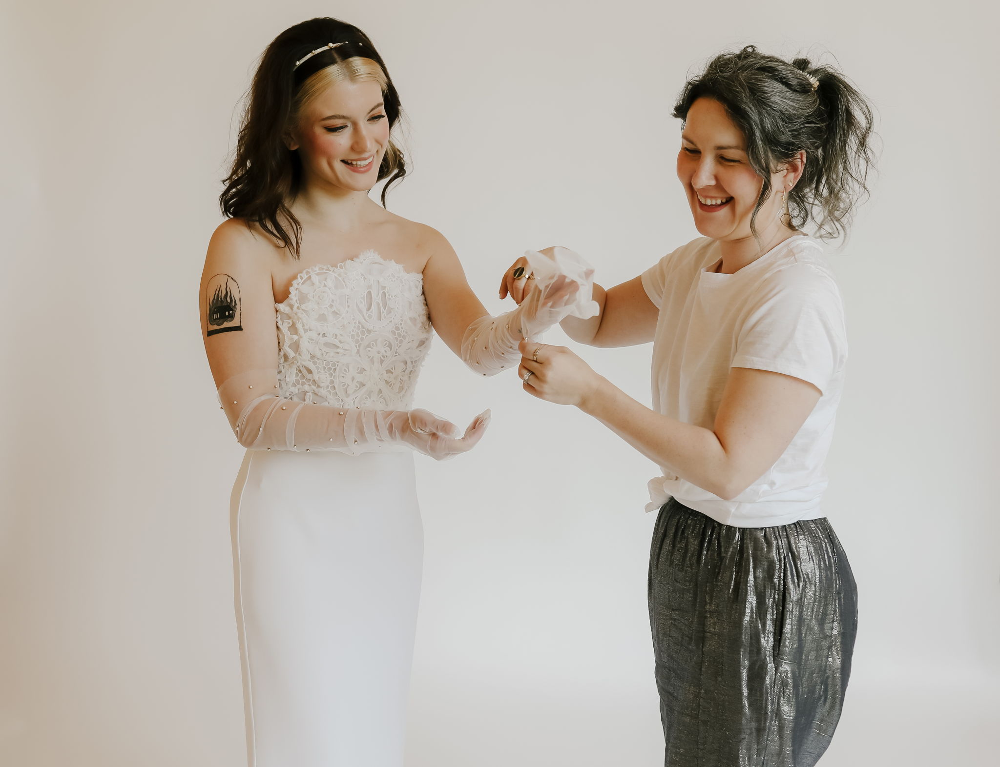 Hushed Commotion founder Thea Block-Neal (right) is preparing her wedding accessories business for the holiday season, as she sees lots of brides waiting for big sales to make their big purchases.