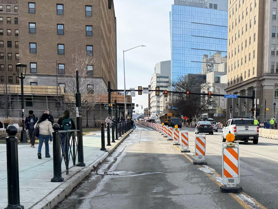 Channelizing barriers recently placed along the former Fifth Avenue counterflow lane