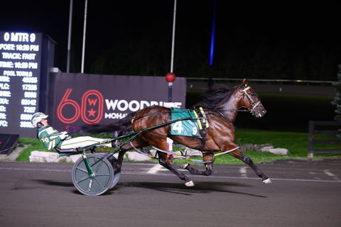 Bythemissal and driver Yannick Gingras winning the second Canadian Pacing Derby Elimination on August 26, 2023 at Woodbine Mohawk Park (New Image Media)