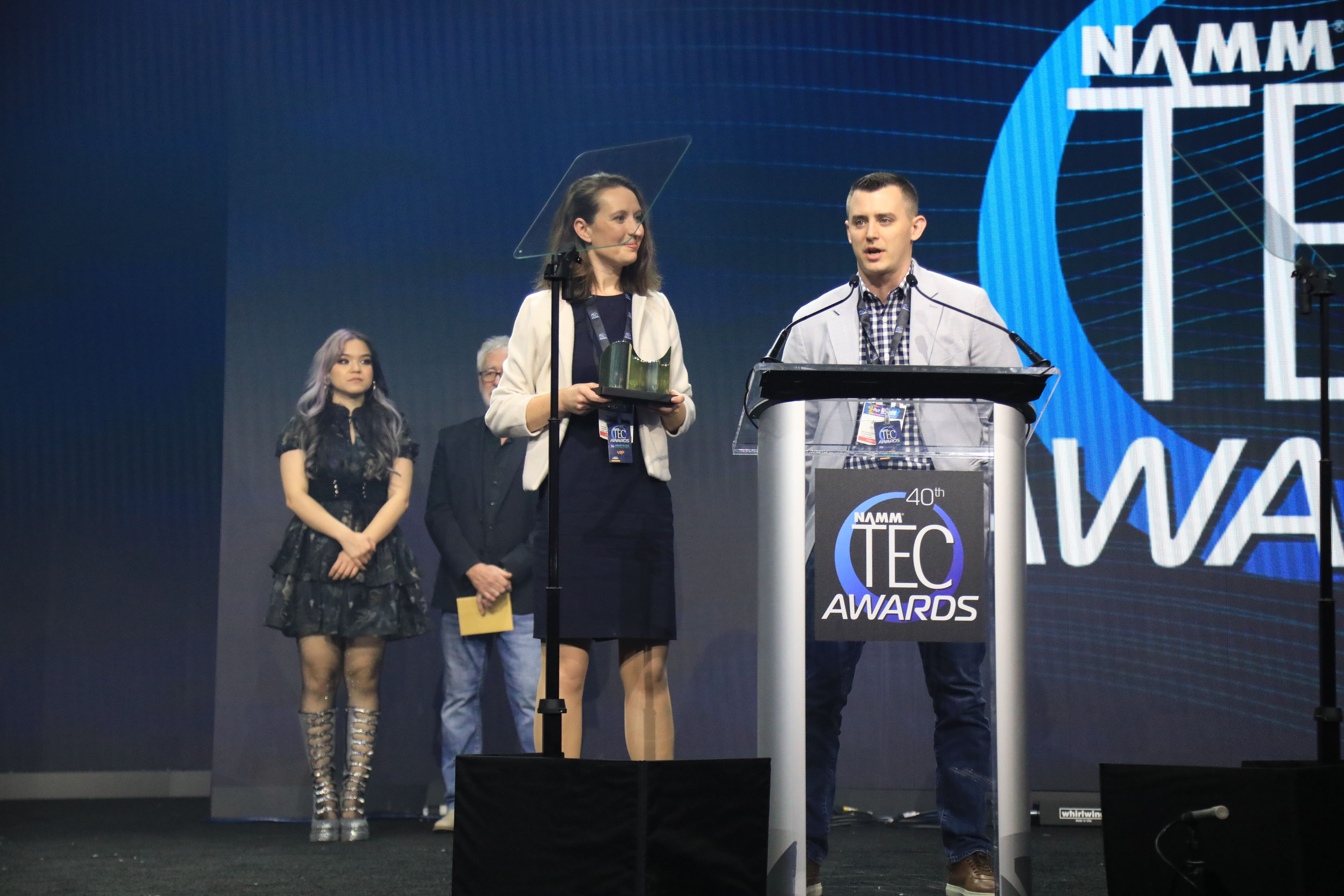 Neumann's Yasmine Riechers and Jonathan Ruest accept the TEC Award for Microphones – Sound Reinforcement