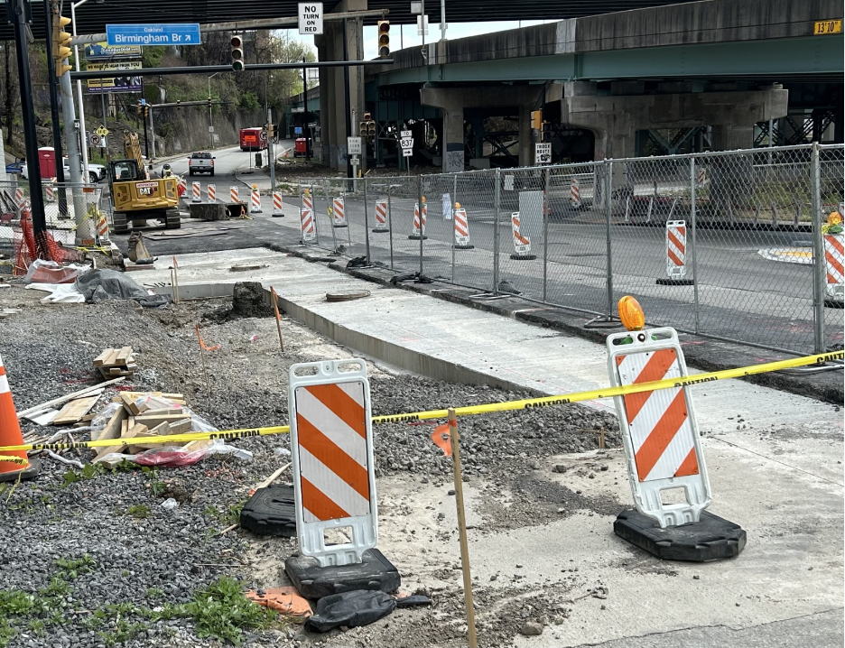 Ongoing installation of new road, curbs and sidewalk on Forbes Avenue past Moultrie Street Ongoing installation of new road, curbs and sidewalk on Forbes Avenue past Moultrie Street