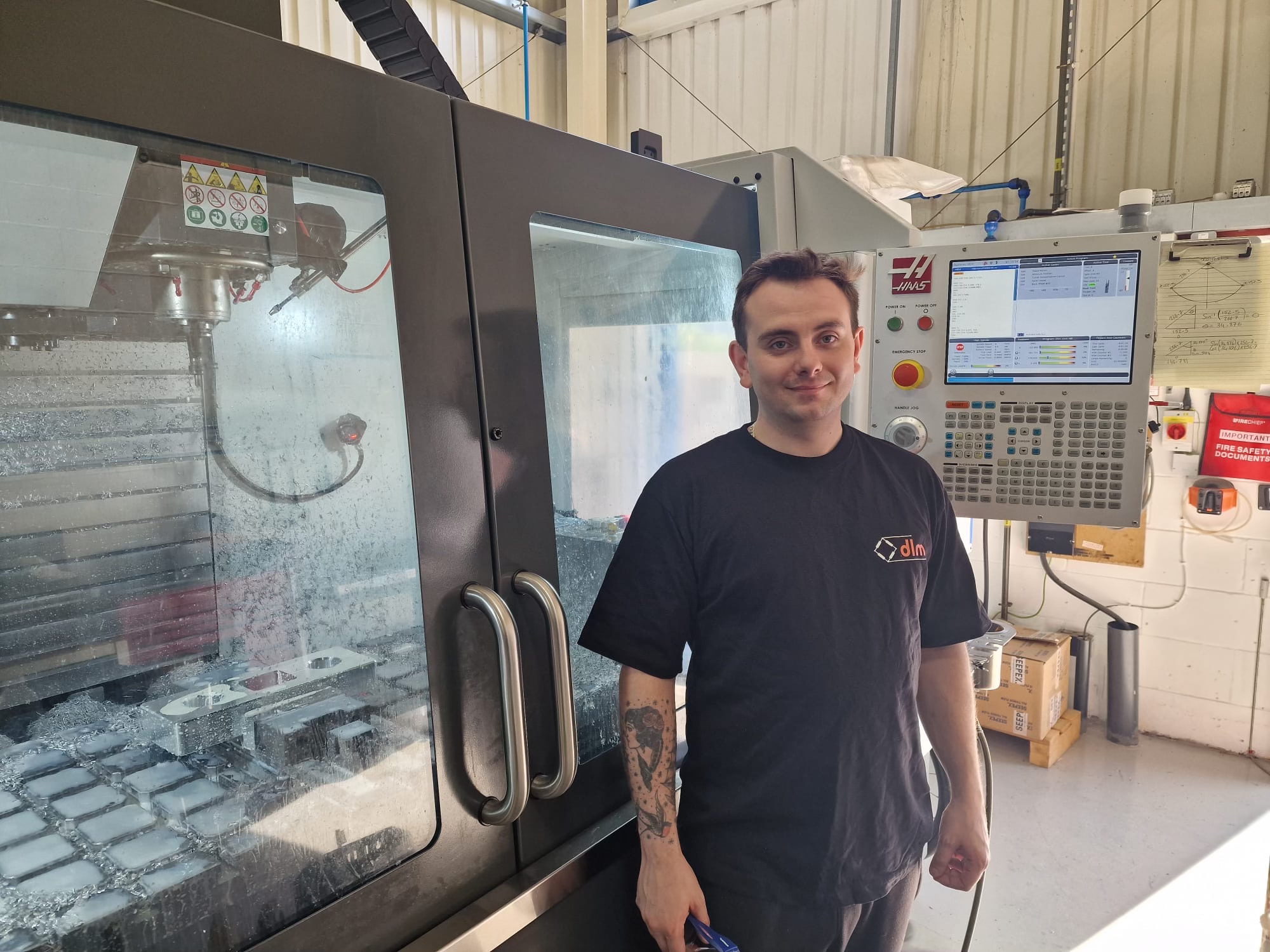 Gavin Short, CNC miller, and a tensile link in a DLM mill. Gavin Short, CNC miller, and a tensile link in a DLM mill.