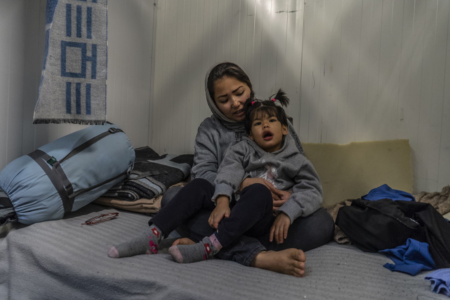“My daughter Zahra is suffering from autism. In the place we live there is no water and almost no electricity. There is not enough space for her to play. This situation is very, very, very difficult for Zahra. I want a place where my daughter can play like other kids and a place that she can be seen by a good doctor.” Shamseyeh, 23, from Afghanistan. “Sometimes due to the cold weather and because we have nothing to keep warm she has seizures in the middle of the night.”  
Zahra is six years old. She lives with her parents in Moria in a small compartment within a room shared with dozens of asylum-seekers with no regular electricity and no privacy. Toilets and water taps are shared. On the island the specialised care that Zahra needs for her condition to be improved is not available, while the living conditions are affecting her well-being. At the moment there are more than 19,000 people living in Moria camp which was initially made to host 3000 people. Over the past four months MSF doctors have seen at least 140 children with chronic and complex cases who have no access to medication and the specialised care they need. If left untreated, some of them may face life-long consequences or even death. Photo taken 20 January 2020, credit Anna Pantelia / MSF