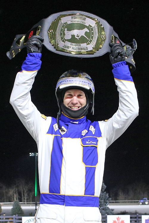 James MacDonald received a custom championship belt for securing his fourth consecutive Woodbine driving title. (New Image Media)