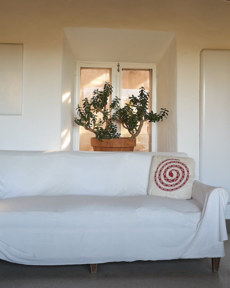 A pillow made from fabric gifted to Georgia O'Keeffe by Alexander Girard, featuring his iconic coiled snake motif; Captured at O'Keeffe's home in in Abiquiú, NM by Mariko Reed for Herman Miller A pillow made from fabric gifted to Georgia O'Keeffe by Alexander Girard, featuring his iconic coiled snake motif; Captured at O'Keeffe's home in in Abiquiú, NM by Mariko Reed for Herman Miller