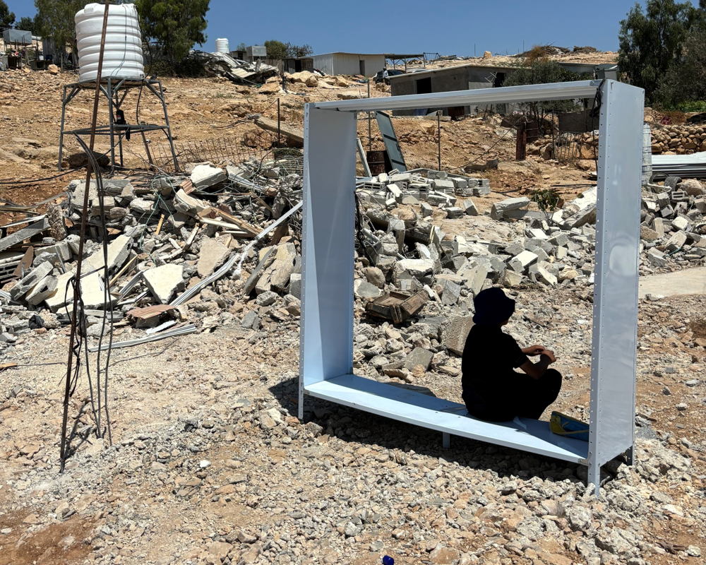 Palestinian teenager finding shelter from the sun after his home was suddenly demolished without warning in Umm al Kheir, Masafer Yatta, West Bank, Occupied Palestinian Territories. Copyright: /MSF