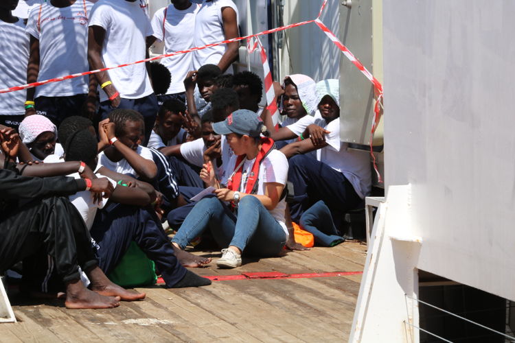 Yuka Crikmar MSF Humanitarian Affairs officer is registering people on board the Ocean Viking. 

The MSF team on board the Ocean Viking register rescued people as they are brought on board the ship.
Copyright: MSF/Hannah Wallace Bowman