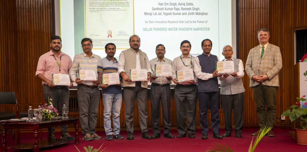 The team that developed the solar-powered water hyacinth harvester.