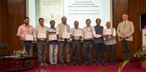 The team that developed the solar-powered water hyacinth harvester.