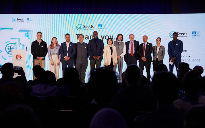 Speakers gather on stage for Huawei Digital Talent Summit group photo.JPG