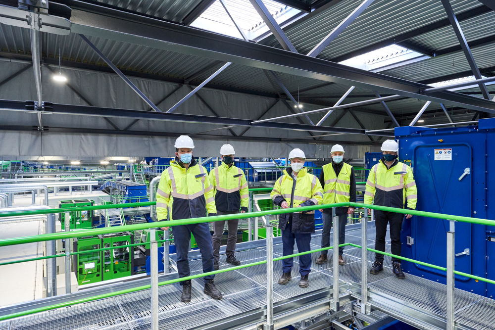 Happy faces at the opening of the new PreZero sorting plant for light packaging in Evergem, Belgium (from left): Christian Kampmann, Head of PreZero Recycling Germany, Claudy Lejeune, Managing Director PreZero Recycling Belgium, Patrick Laevers, CEO Fost Plus, Mik Van Gaever, COO Fost Plus, and Stephan Garvs, Managing Director PreZero Germany. 
