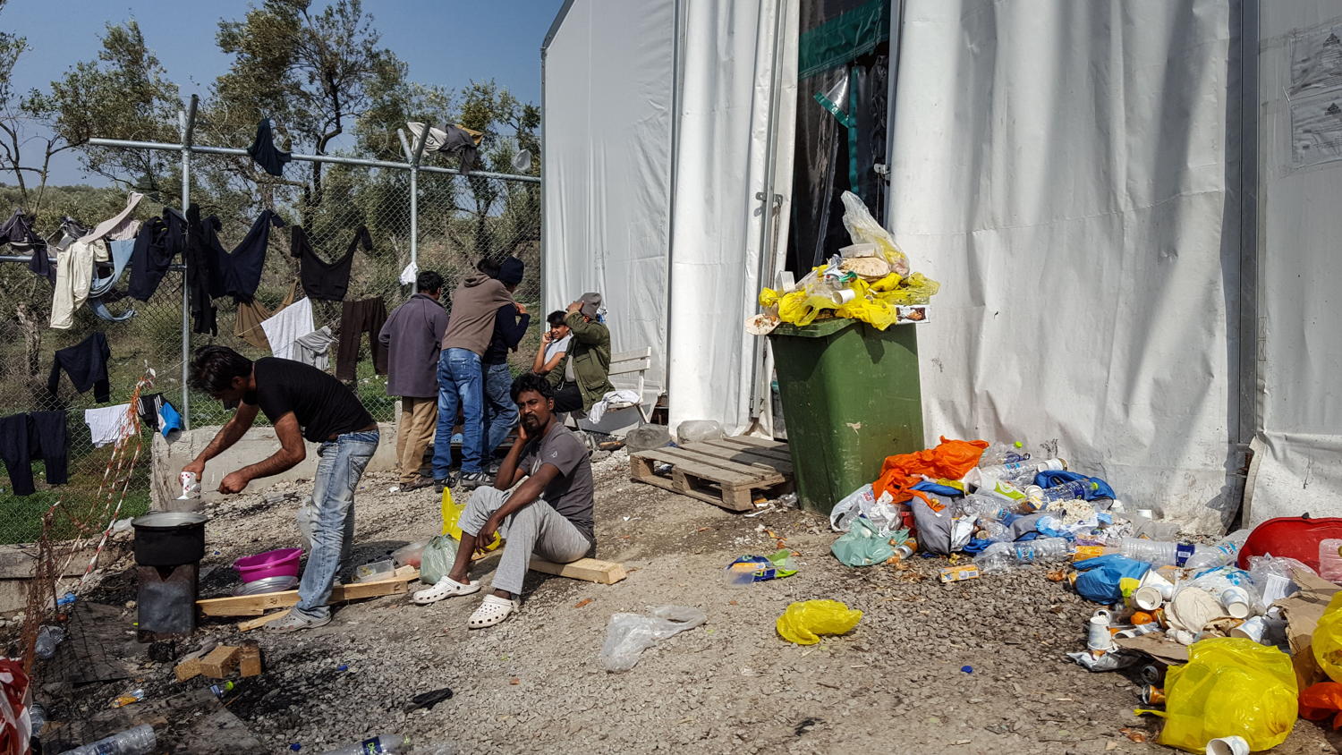 Refugees and migrants from Bangladesh and Pakistan inside Moria Camp.