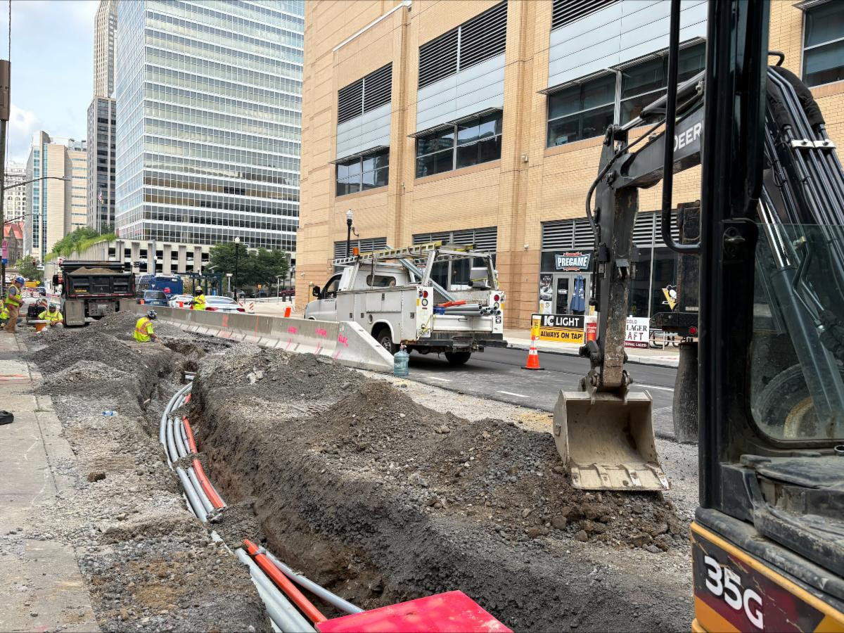 Contractors install a duct bank containing conduit for future traffic signals Contractors install a duct bank containing conduit for future traffic signals