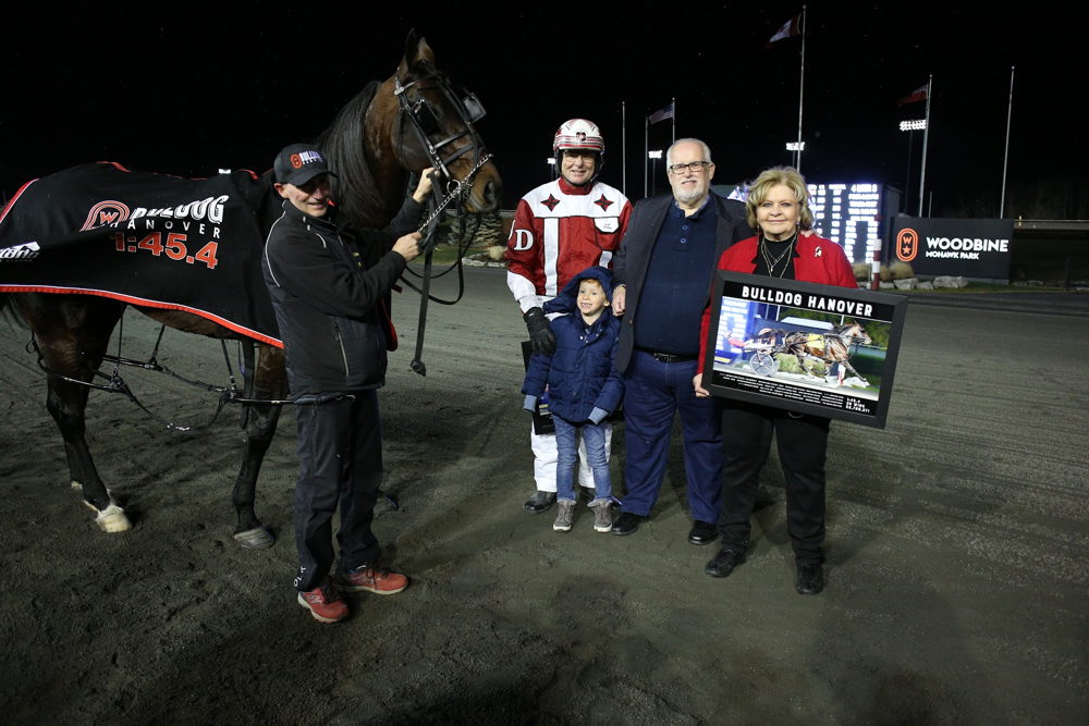 Bulldog Hanover with caretaker Johnny Mallia, trainer Jack Darling and owner Brad Grant and his wife, Bonnie. (New Image Media)