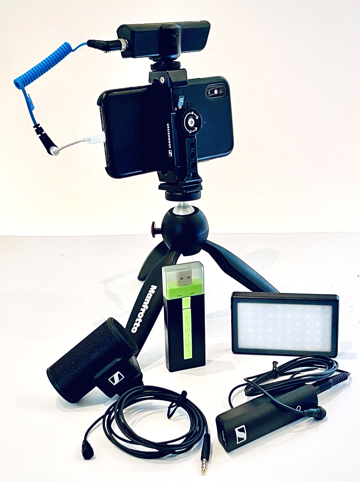 Figure 11.   Intermediate Kit  with iPhone XS, XS Wireless Digital Portable Lav Mobile Kit (includes Manfrotto PIXI and Smartphone Clamp), MKE 200 vlogging microphone, XS Lav Mobile clip-on mic, Airstash, Lume Cube Panel Mini, and TRRS to Lightning adaptor  (Photo credit: Ivo Burum)