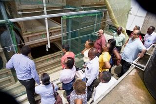 An OECS and wider delegation visit the aquaponics facility in Choiseul and desalination plant in Laborie.
