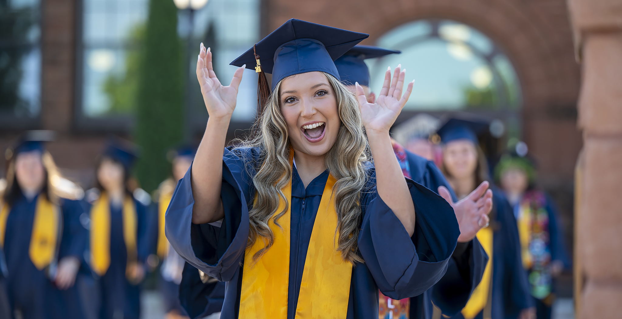 A graduating UCO student participating in the Spring 2024 Commencement Old North walk. ​