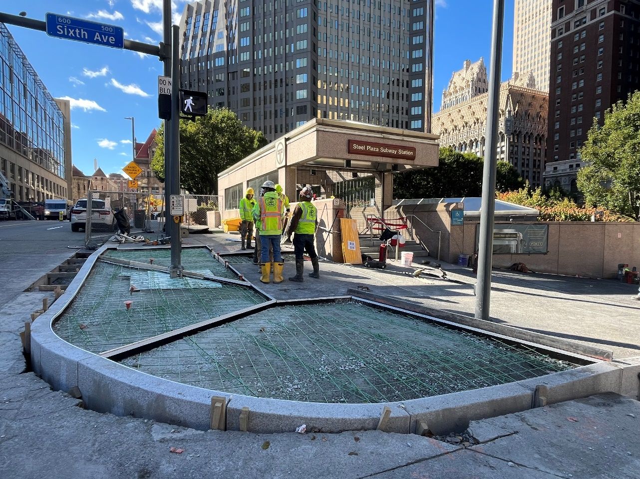 Frame for new sidewalk and accessible ramps at Sixth Avenue and Ross Street