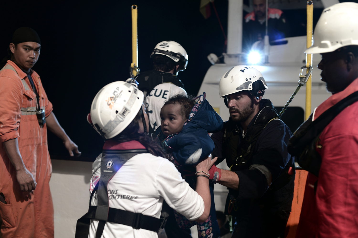 09 June, 2018 - Teams assist a little girl onboard Aquarius, a search and rescue ship run by SOS Mediterranee in partnership with MSF. Credit Kenny Karpov/SOS MEDITERRANEE