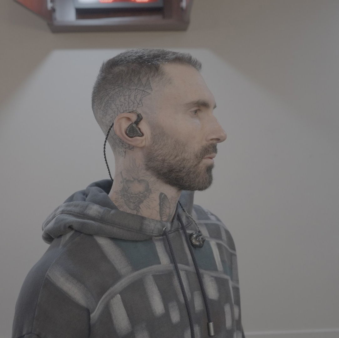 Adam prepares to take the stage with his trusted in-ear monitors, powered by Sennheiser Spectera (photo courtesy of Travis Schneider)