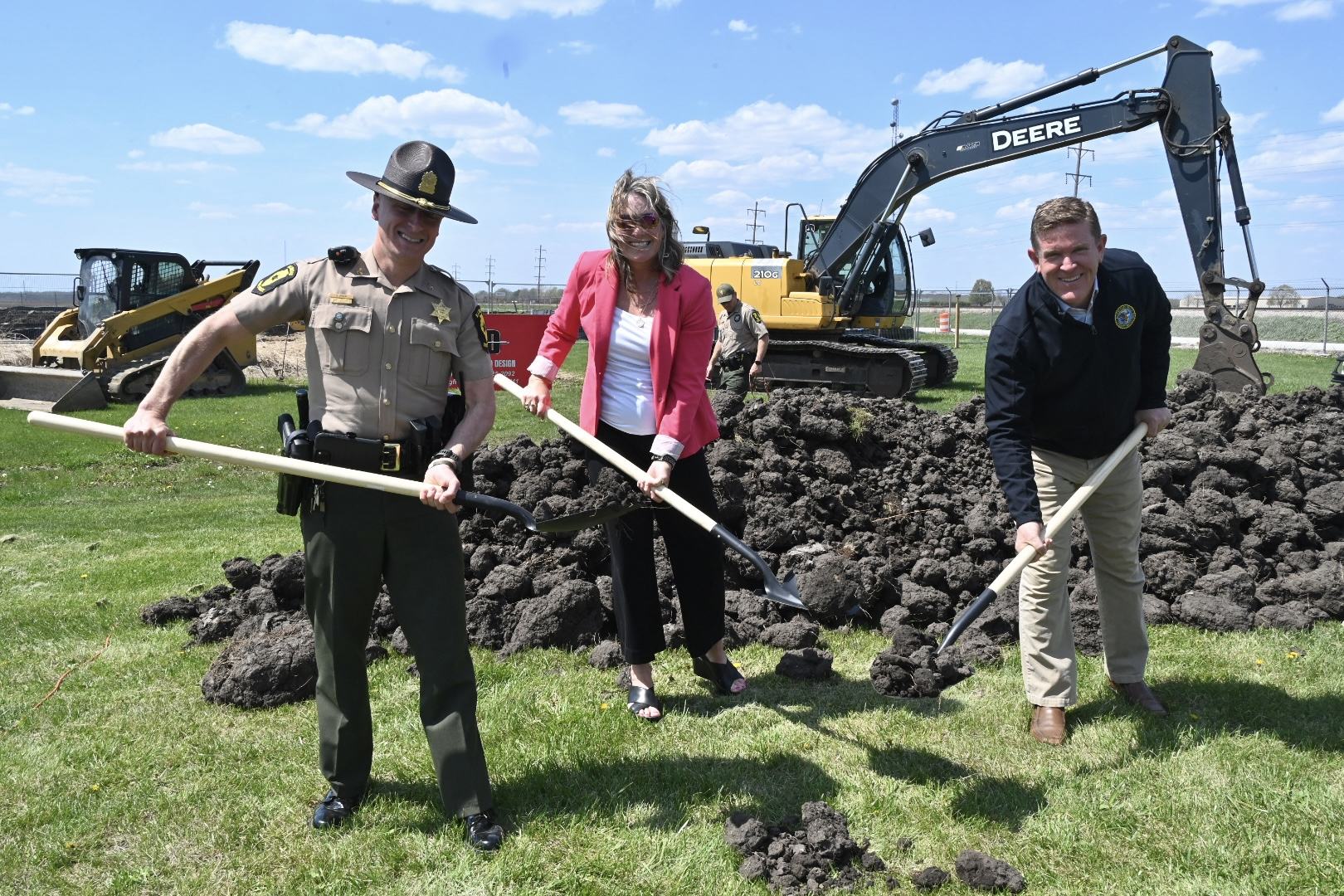 ISP Col. Chris Owen, CDB Deputy Director of Construction Lisa Hennigh, ISP Director Brendan Kelly break ground on canine facility.