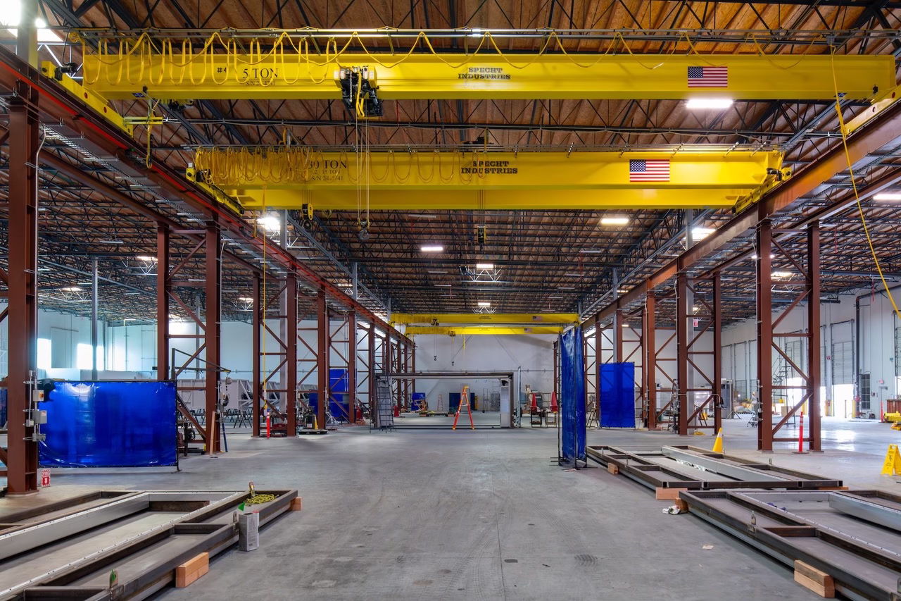 A combination of four overhead bridge cranes and two hoists were required.