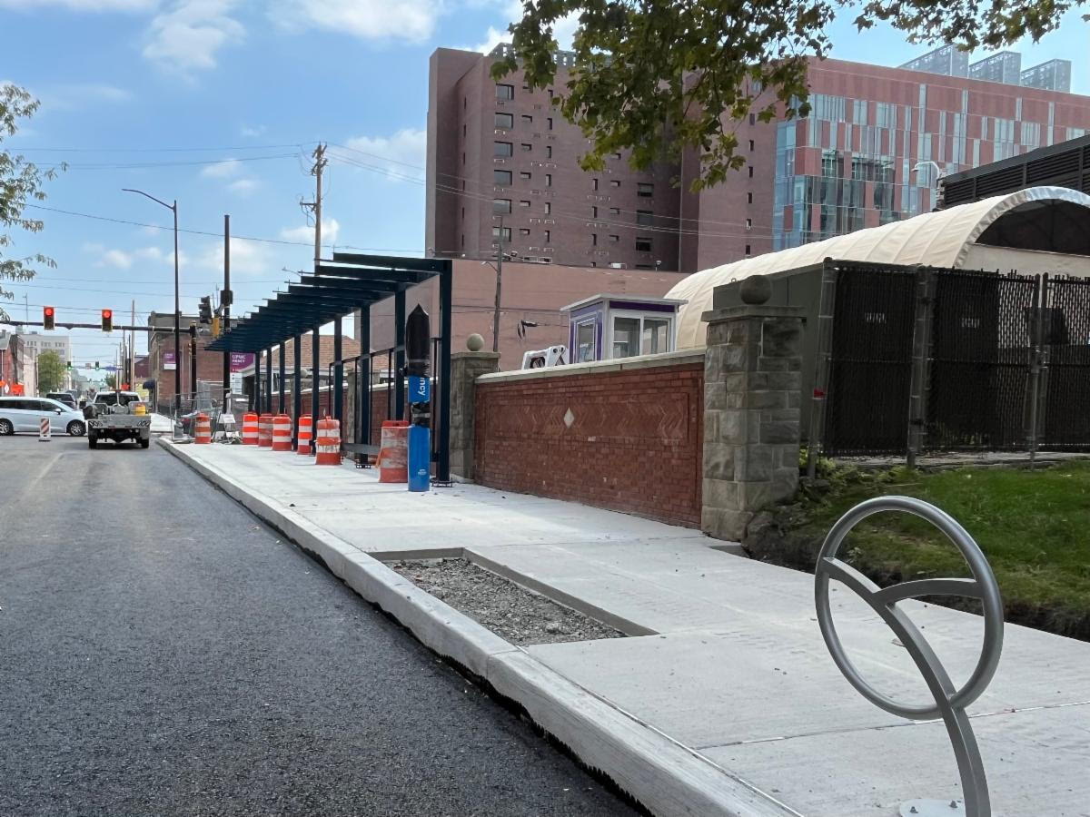 New shelter frame installed at Forbes Avenue and Pride Street along with emergency phones and bike rack in foreground New shelter frame installed at Forbes Avenue and Pride Street along with emergency phones and bike rack in foreground