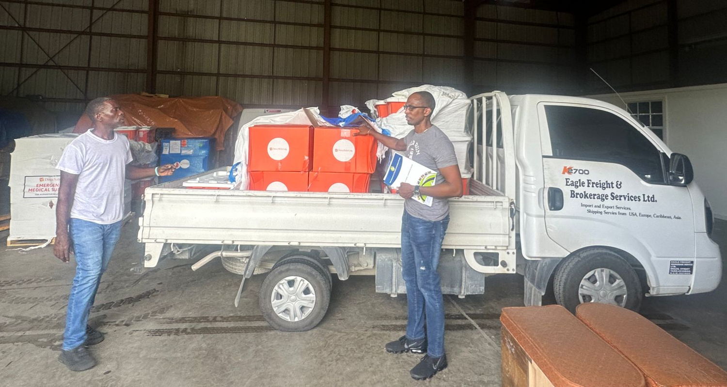OECS Staff loading medical supplies for delivery to Grenada.