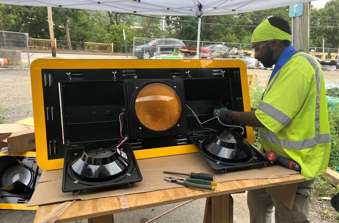 One of 35 new traffic signals being assembled