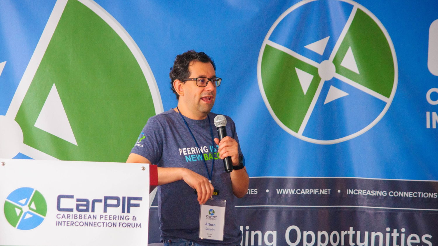 Caption: Arturo Servin, Peering Coordinator for Google, presenting at CarPIF 2018 in Belize City Belize. Photo Credit: Caribbean Peering and Interconnection Forum. 