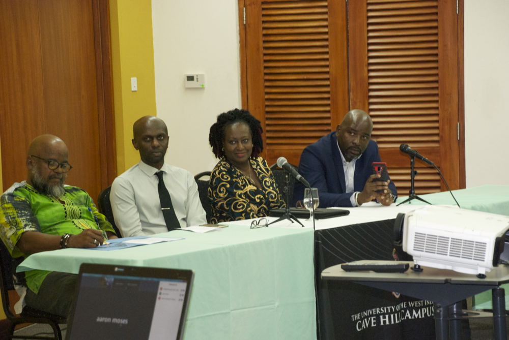 L-R (Mr. Neil Paul, SRC Director; Prof. Winston Moore, Deputy Principal; Dr. Wendy Grenade, Head of the Department of Government, Sociology, Social Work and Psychology; and Mr. Winsbert Louison, ACP TradeCom II Programme Project Manager at the OECS Commission). L-R (Mr. Neil Paul, SRC Director; Prof. Winston Moore, Deputy Principal; Dr. Wendy Grenade, Head of the Department of Government, Sociology, Social Work and Psychology; and Mr. Winsbert Louison, ACP TradeCom II Programme Project Manager at the OECS Commission).