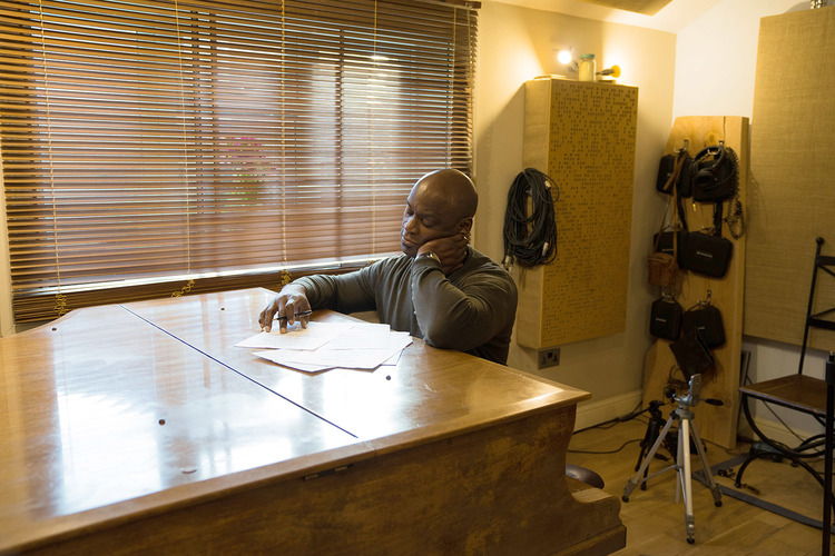 Ola Onabulé working in his own studio