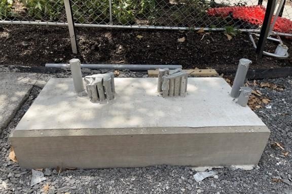 New concrete foundation recently poured for a new traffic signal control box New concrete foundation recently poured for a new traffic signal control box