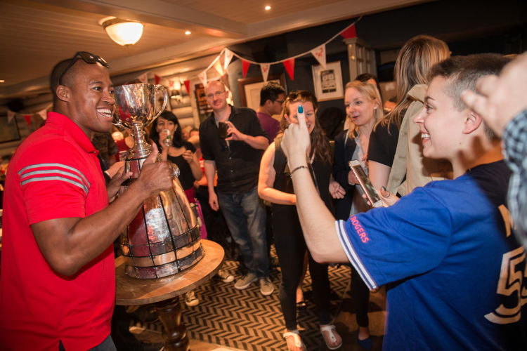 Henry Burris poses for a fan. Photo Credit: Jim Ross/CFL