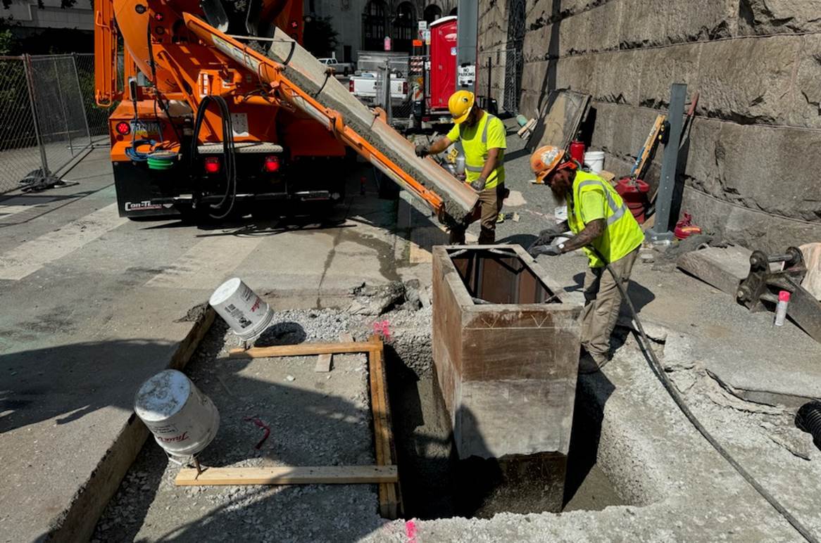 Inside the work zone at Sixth Avenue and Diamond Street, a modified catch basin was placed to support drainage