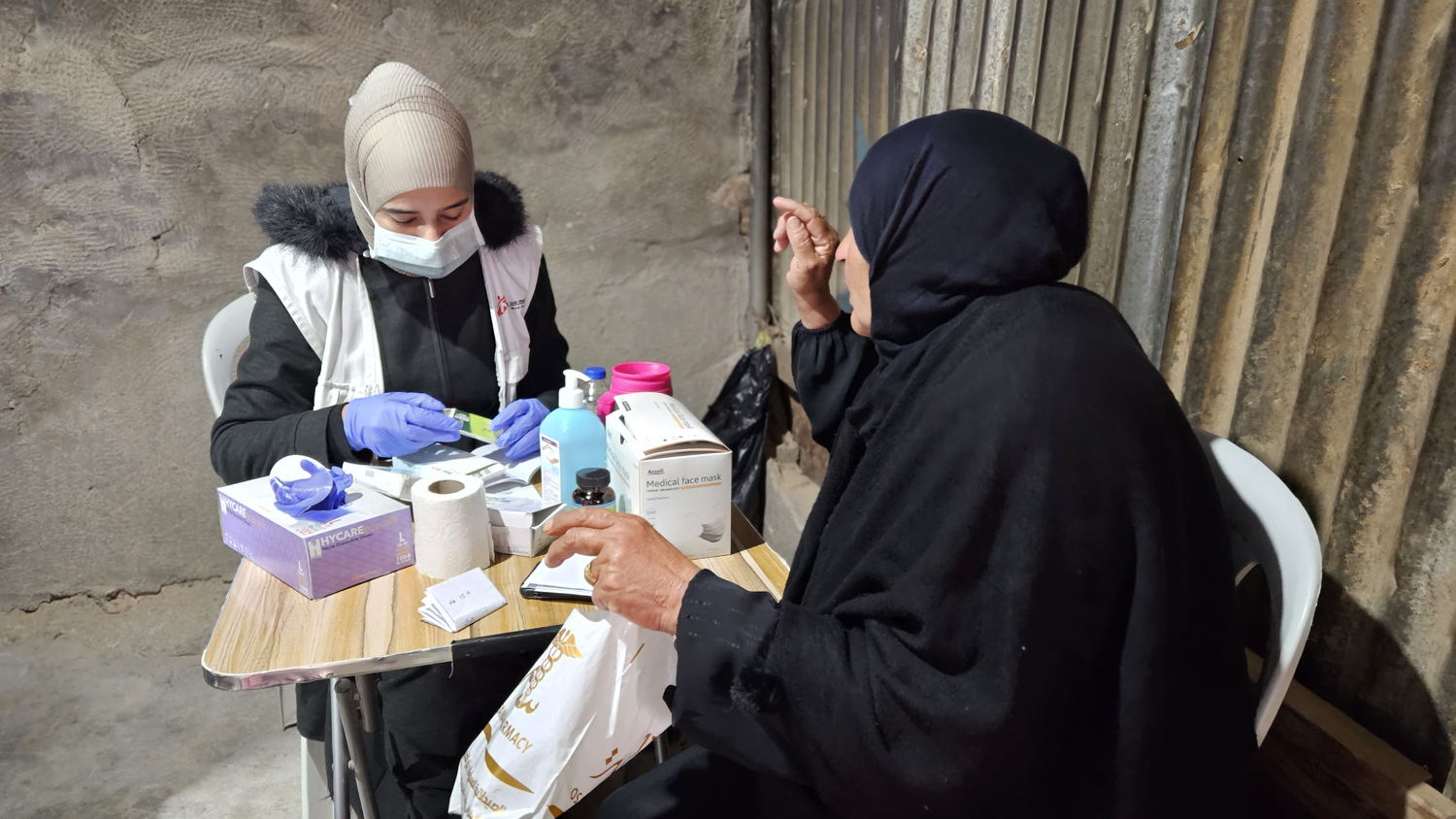 Fatima* came with her granddaughter to the mobile clinic set up by MSF in Umm Qussa gathering in Masafer Yatta, to bring healthcare closer to the communities. She was one of the first ones to arrive that day. It is her first medical consultation for the past nine months. Copyright: Laora Vigourt/MSF