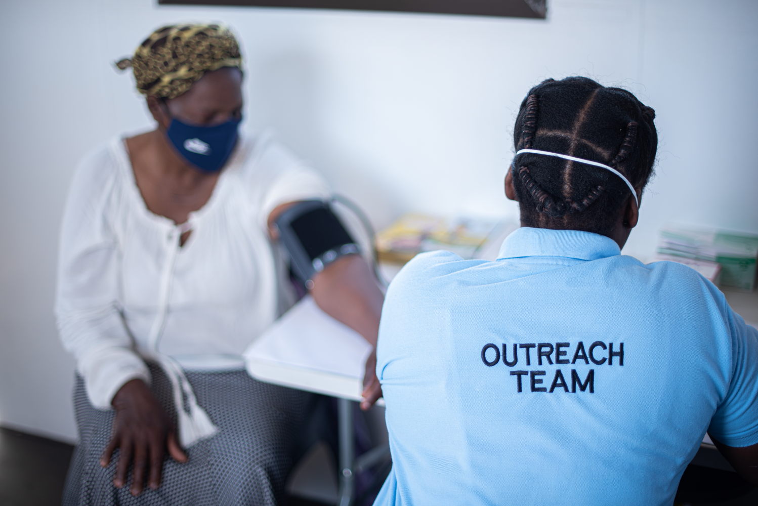 A member of the Mqalana community in rural KwaZulu-Natal has her blood pressure tested by a healthcare worker at a newly opened Luyanda Site. Luyanda Sites are decentralized hubs for HIV and TB services. The Mqalana site is housed in a parkhome unit donated by MSF. During the COVID-19 epidemic, Luyanda Sites have served as medicine pick-up points for patients with chronic conditions. Photographer: Chris Allan