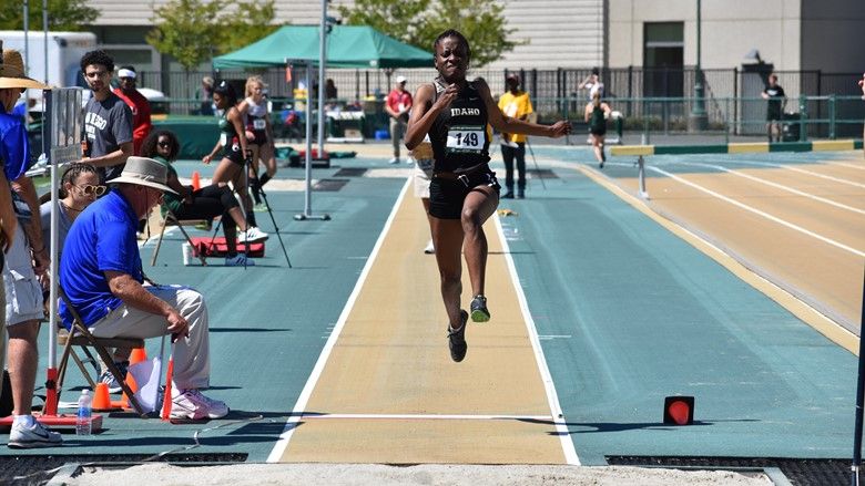 Rechelle competes in the long jump.