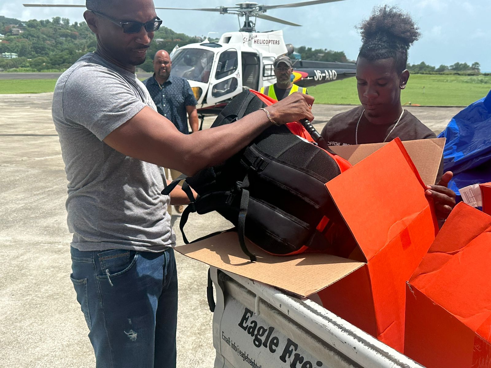 Staff of the Organisation of Eastern Caribbean States (OECS)-Pooled Procurement Services (PPS), pictured in St. Lucia, loading Direct Relief field medical packs, filled with first aid products for triage care, as well as other essential medications into a helicopter for delivery to OECS Member States impacted by Hurricane Beryl.