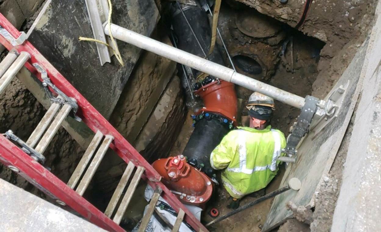 A new 12-inch water main being installed at Sixth Avenue and Smithfield Street A new 12-inch water main being installed at Sixth Avenue and Smithfield Street