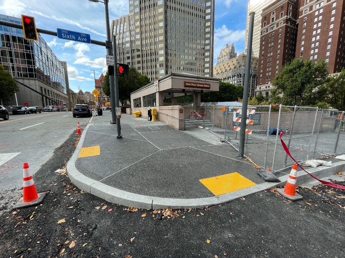 New sidewalk and accessible ramps recently placed at Sixth Avenue and Ross Street