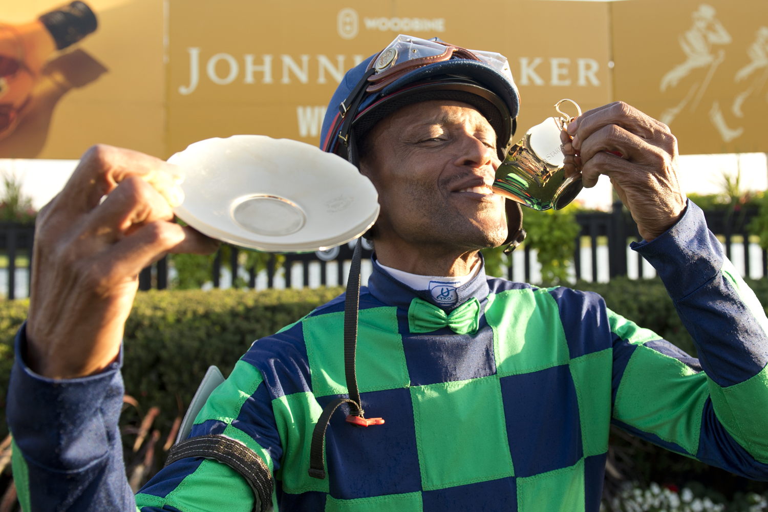 Patrick Husbands with the Cup & Saucer in Woodbine's winner circle on October 6, 2024 (Michael Burns Photo)