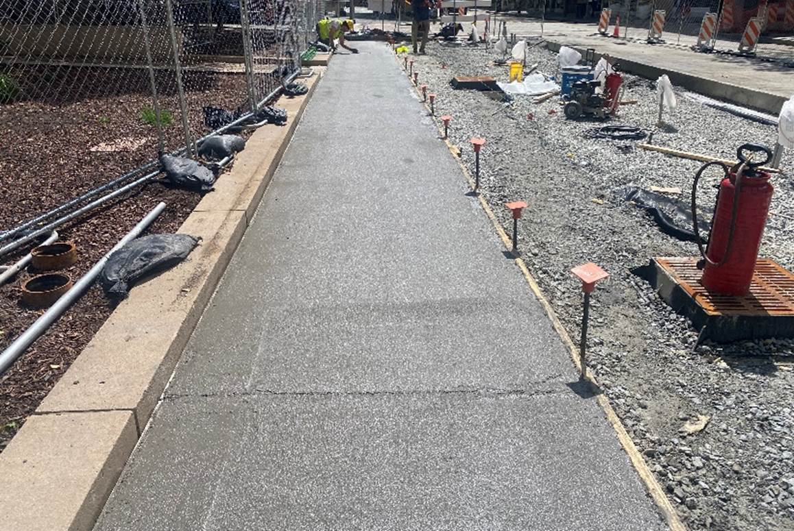 New sidewalk recently poured at Fifth Avenue and Liberty Avenue New sidewalk recently poured at Fifth Avenue and Liberty Avenue